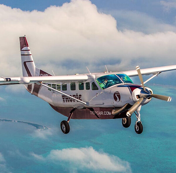 Getting to Caye Caulker by Tropic Air Plane flying above the sea